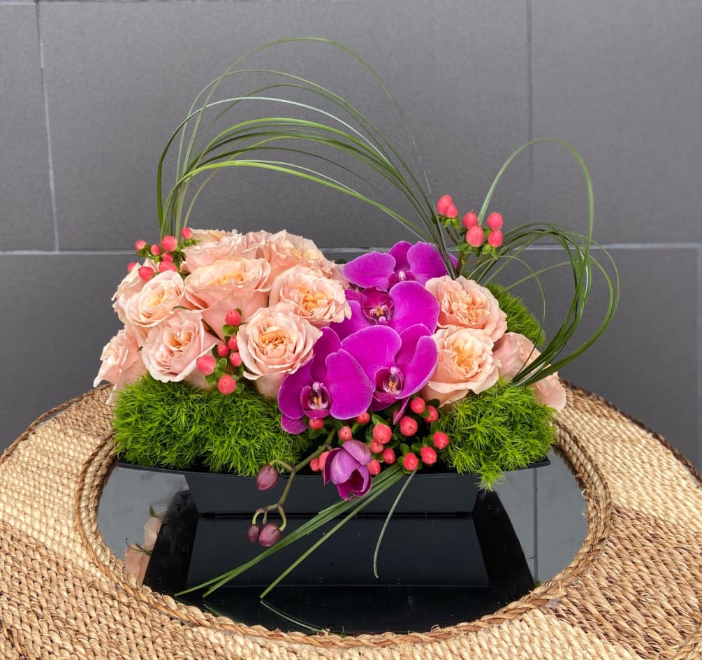 Zen style including fragrant roses, elegant orchids and nice accents.
