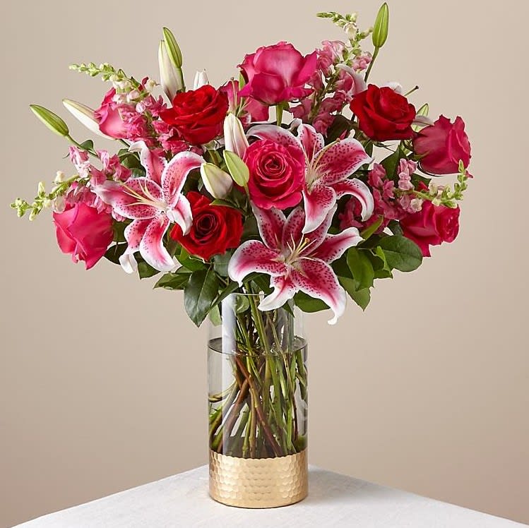 Roses of two different colors, Stargazer, Snap vase with greens