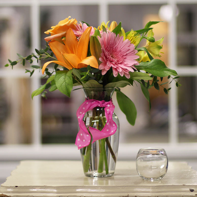 Colorful bouquet with a warm buttery glow. This arrangement will be a
