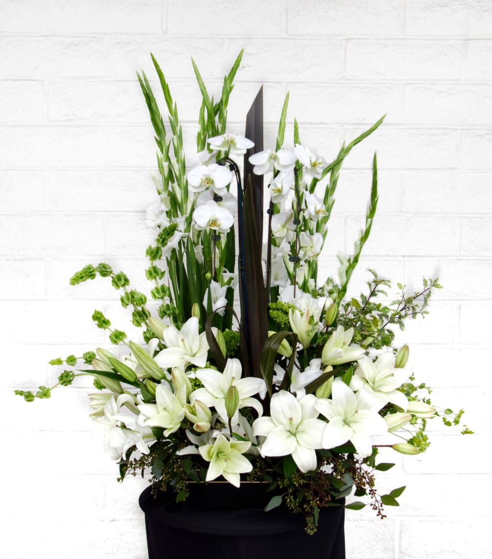 A beautiful design with all white premium flowers and accents. CUSTOMER CAN
