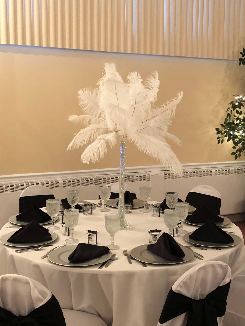 Feather plume centerpiece for various occasions.  Pricing is determined by number