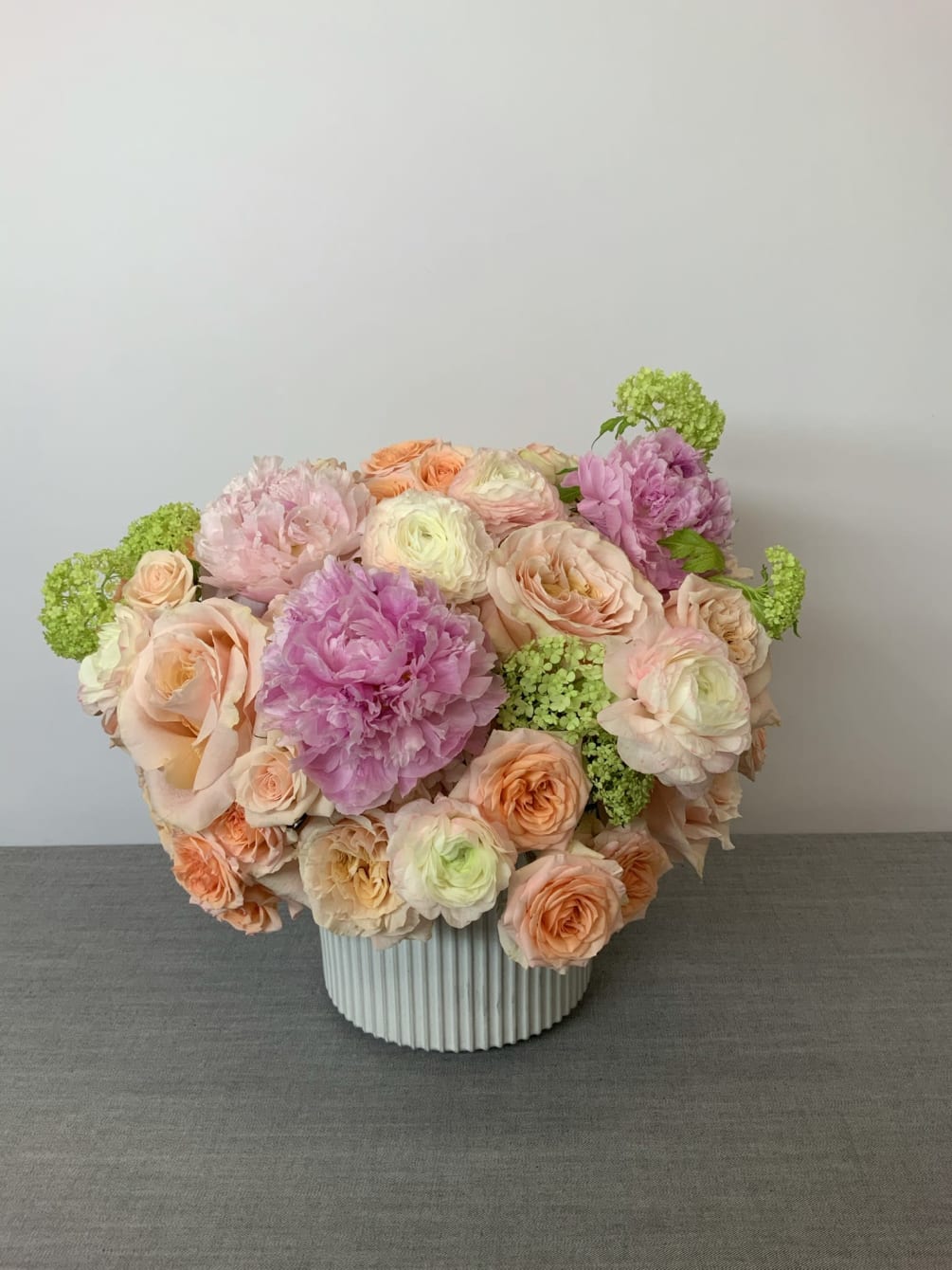 Mixture of roses, peonies, and other perfect flower choices.