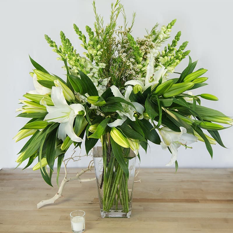 This traditional grand white arrangement is a lovely way to send someone