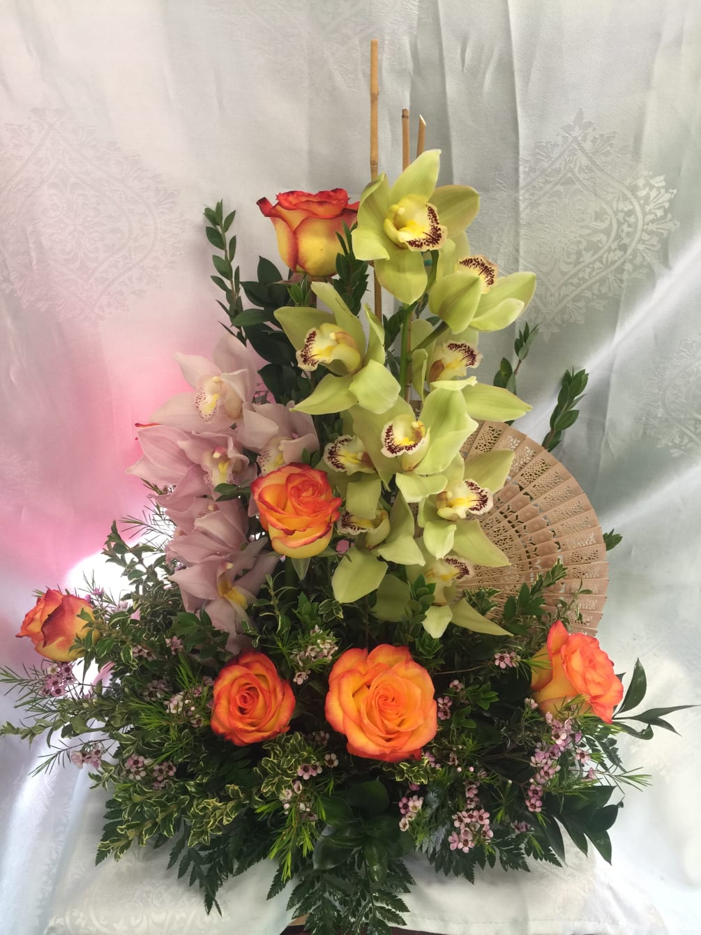Two colorful cymbidium of orchid spray displayed the elegance tower above with