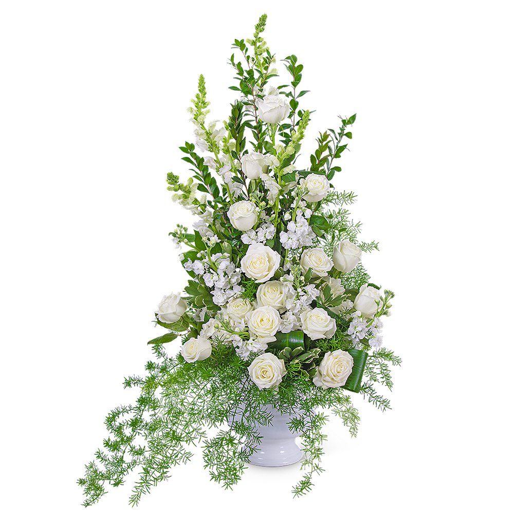 Our Eternal Peace Urn features white roses, hydrangea, snapdragons, stock, and premium