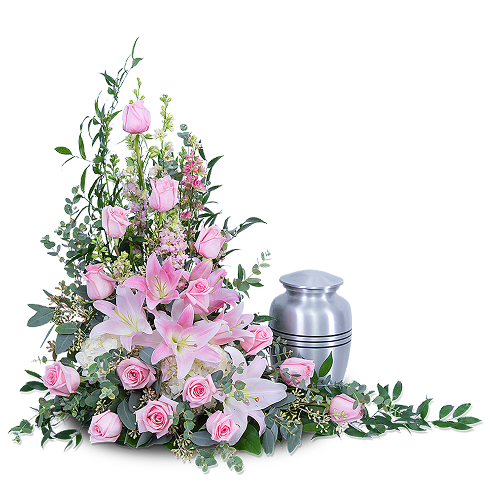 The Forever Adored Tribute features pink roses, lilies, hydrangea, Larkspur, and other