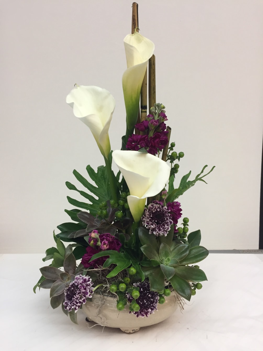 Lush tropical arrangement, comes in a variety of lush greens and blooms