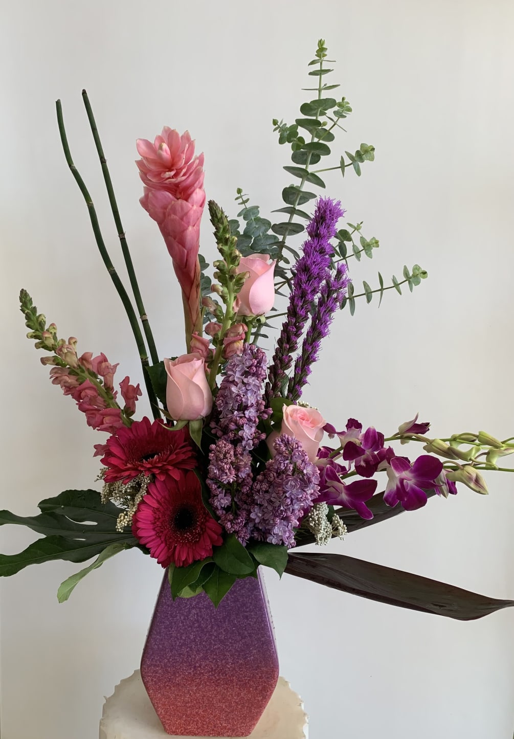 Simple elegant arranged in a beautiful ceremic vase