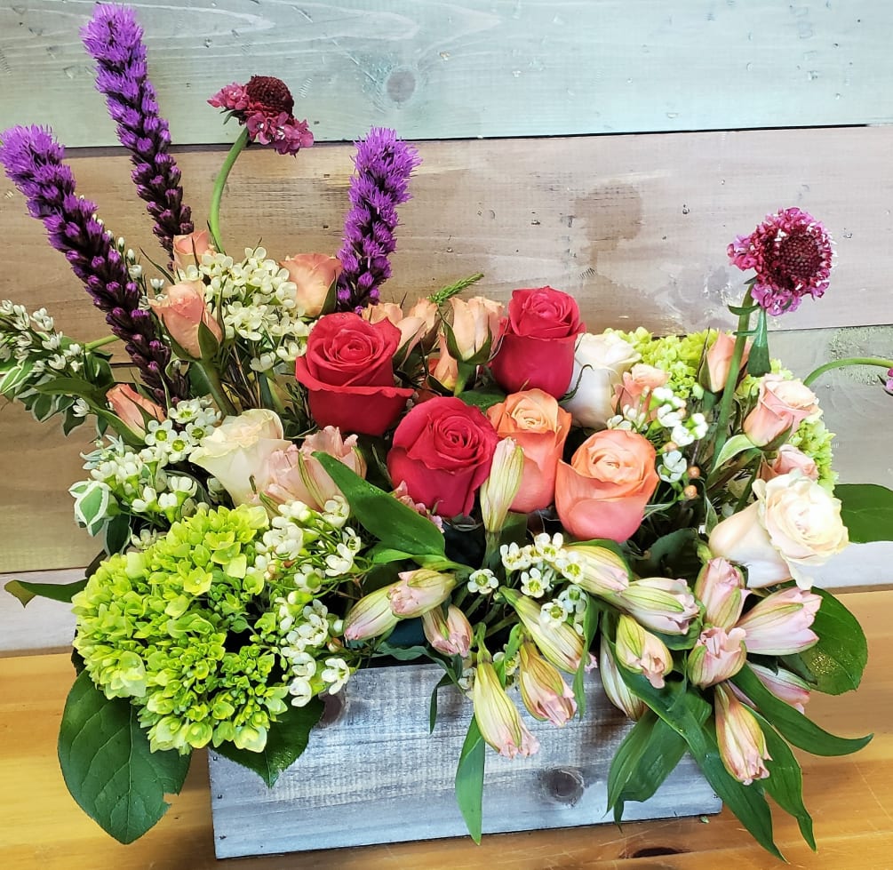 A box of the freshest garden flowers to brighten your day. Colors