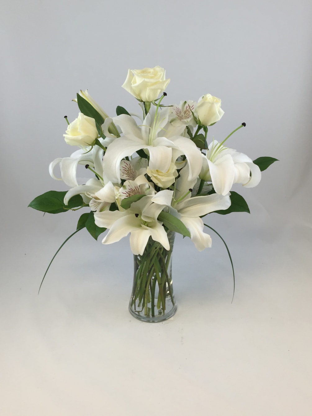 White Roses, White Roses, White Alstroemeria, Variety of greens arranged in a