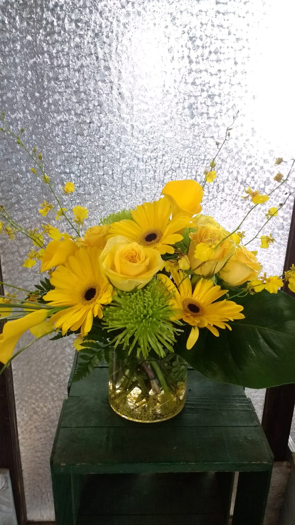 Yellow Gerber Daisies with fuji, Orchids, and Roses