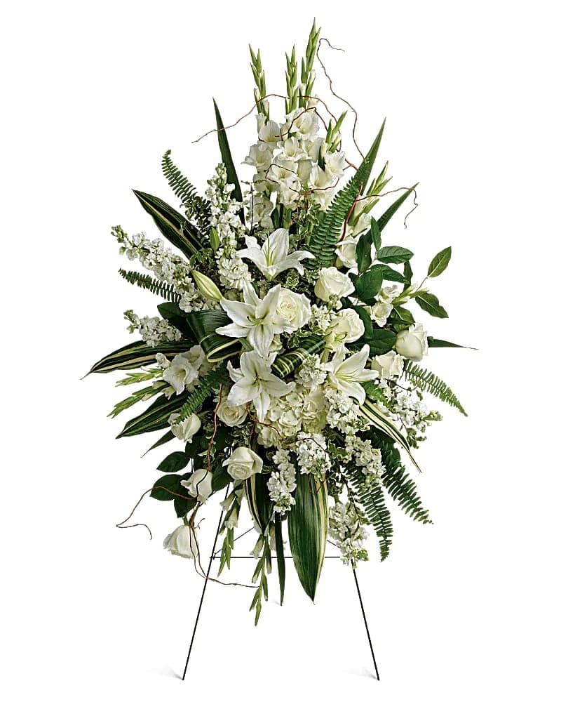 This beautiful spray includes white hydrangea, white roses, white oriental lilies, white