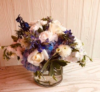 Blue delphinium, hydrangea and white roses.  Short profile.