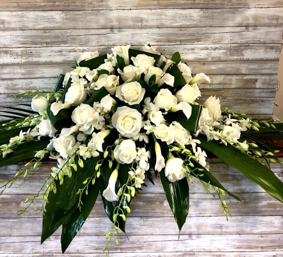 Half-Size casket spray with roses, white mini calla lilies and white orchids