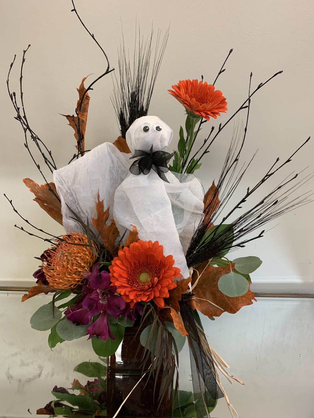 Add a little delight to their Halloween 
with this arrangement.