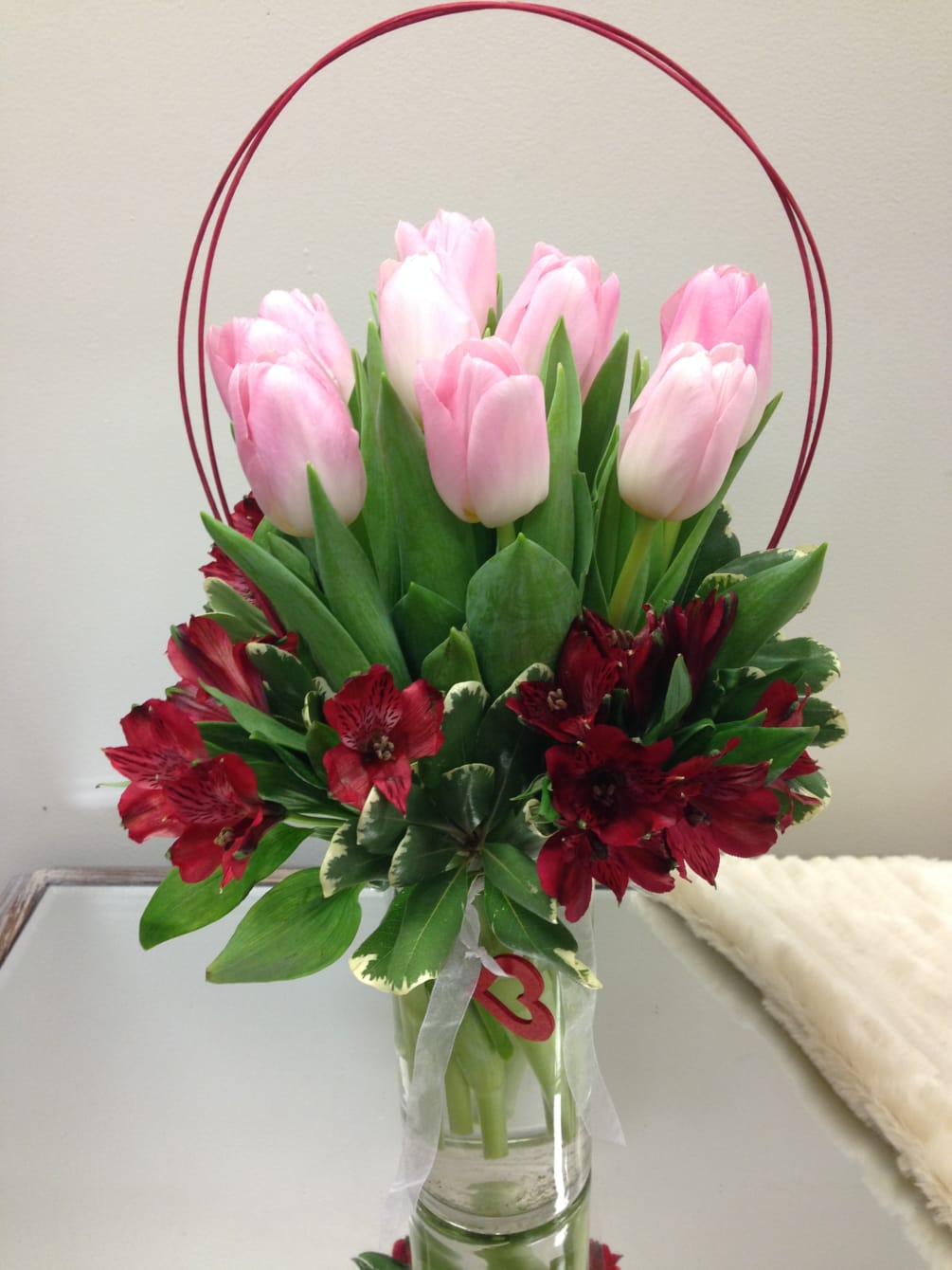 Tulips arranged in a vase accent with alstromeria lily. 
Tell them how