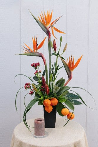 Bird of paradise, asiatic lilies, hypericum, fruits, exotic greens