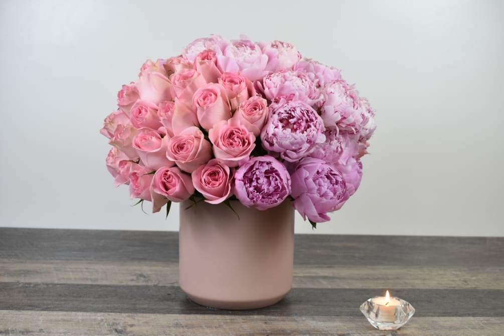 This beautiful Angela Design comes in a blush pink vase with light