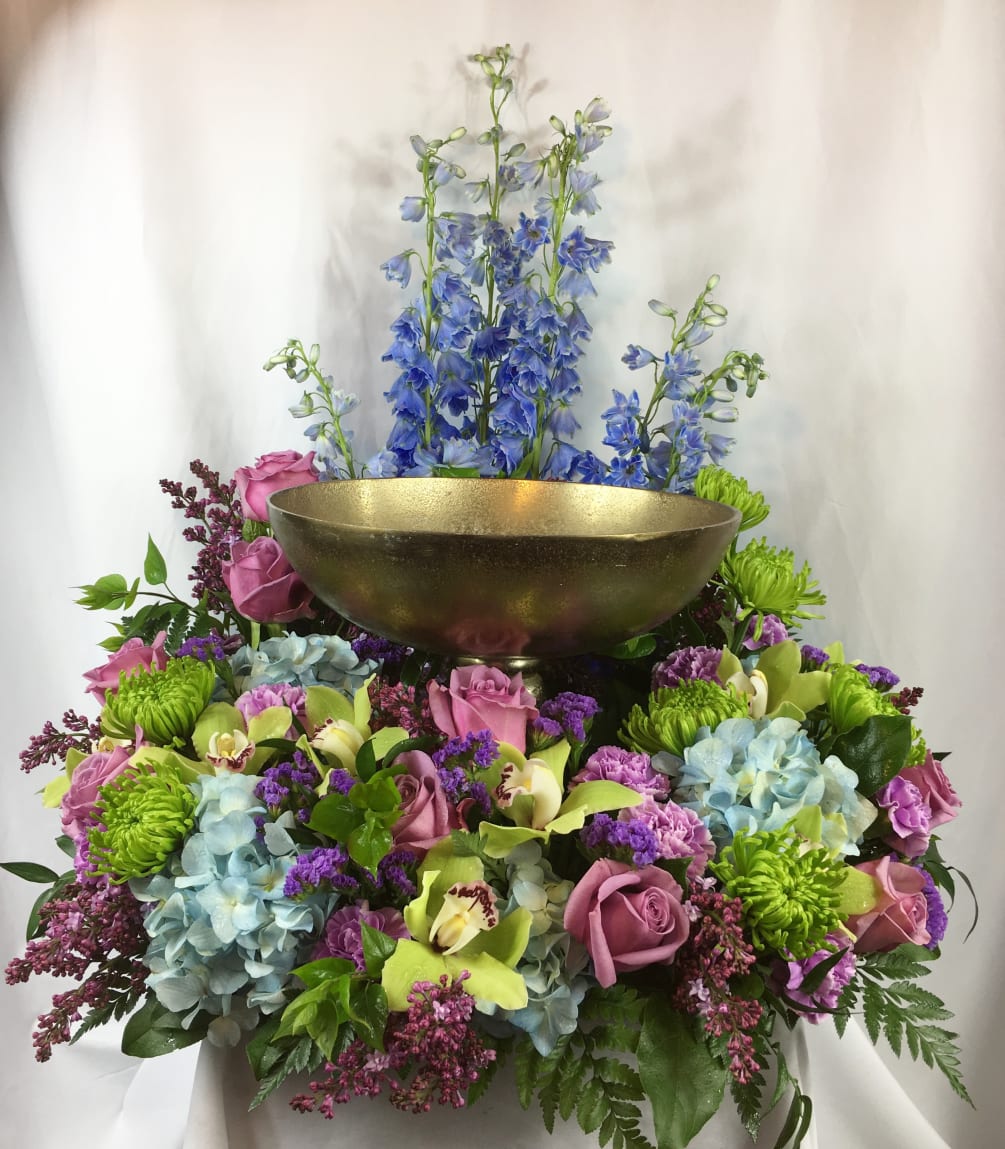 Seasonal Mix of color to gracefully surround the urn.  