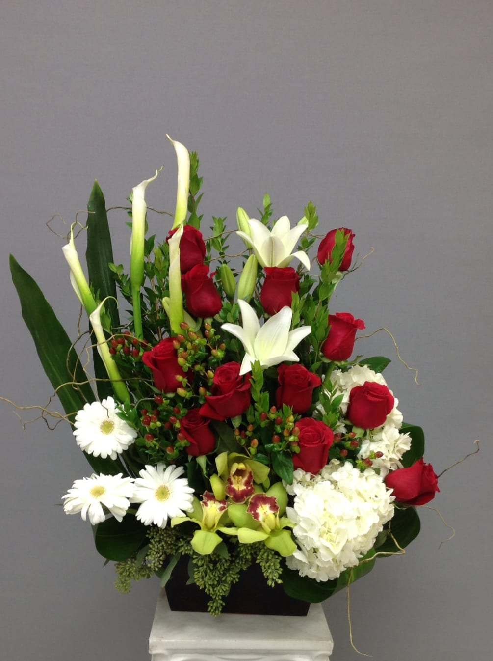 Red and white arrangement designed for Holiday season