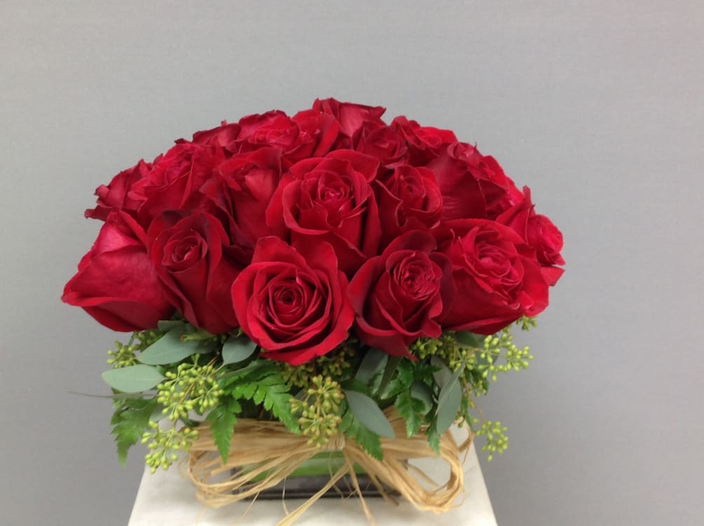 2 Dozen red roses in cube vase
