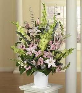 BASKET FILLED WITH LOVELY PINK TONES, FEATURING LILIES, CARNS AND DAISIES. APPROX.