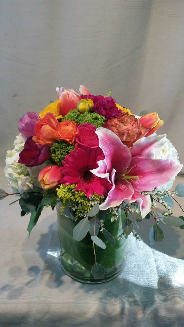 A colorful spring arrangement, lilies, gerberas, hydrangeas, tulips.....