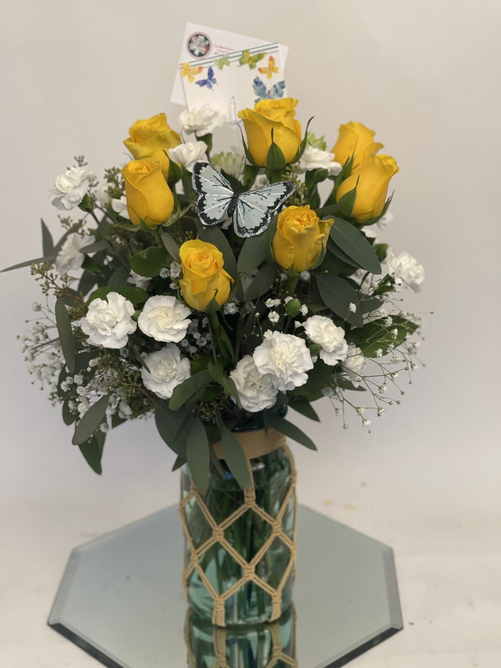 Made with yellow roses and mums