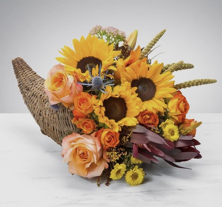  Our cornucopia basket is full of timeless beauty, designed with lush