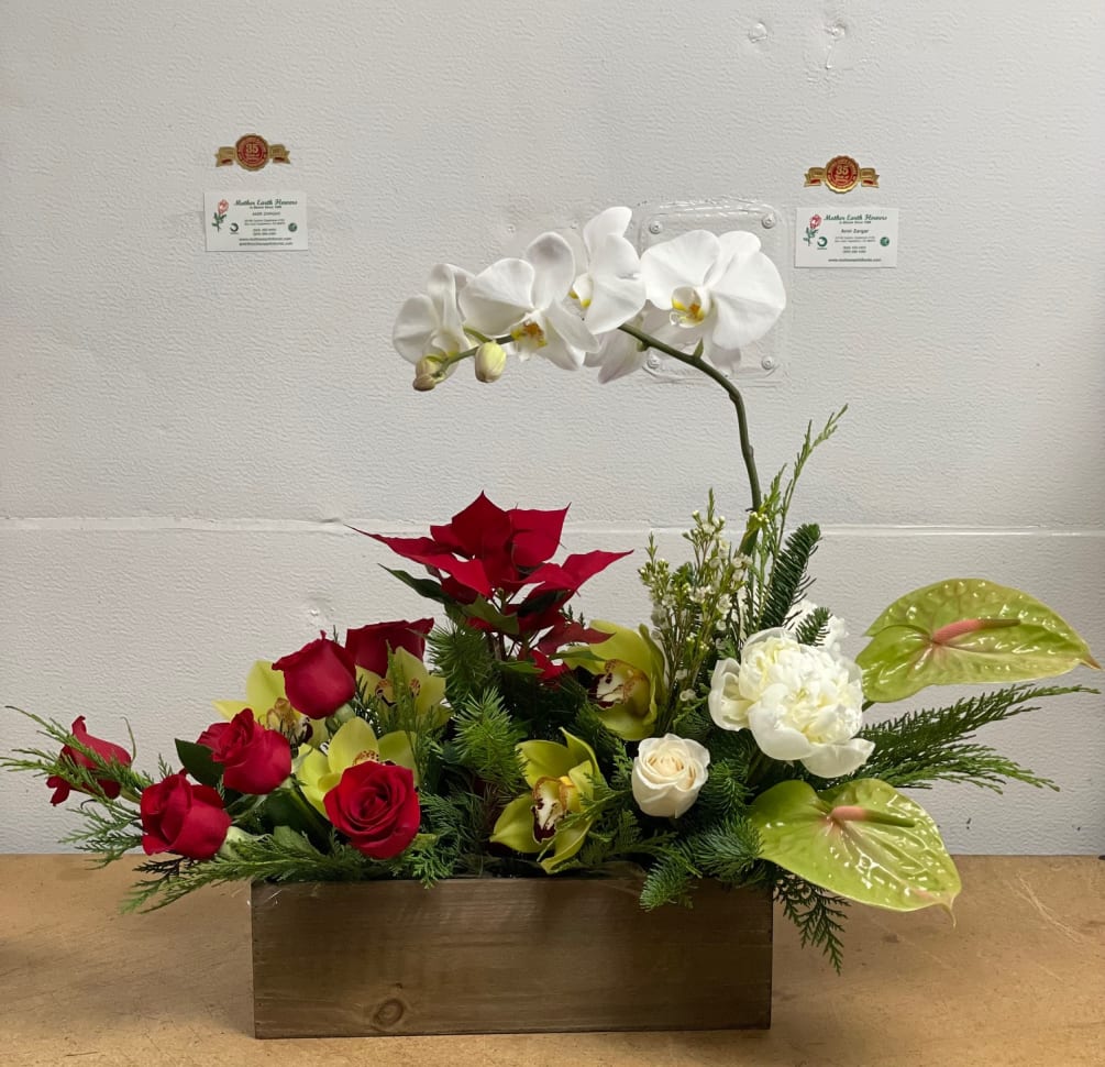 arrangement of live poinsettia, orchid, roses , peony and anthurium  