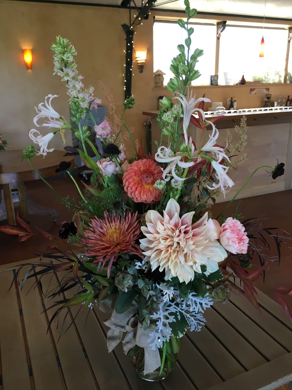 Pretty, romantic, old-fashioned flowers in a simple glass vase. Fluffy Dahlia And
