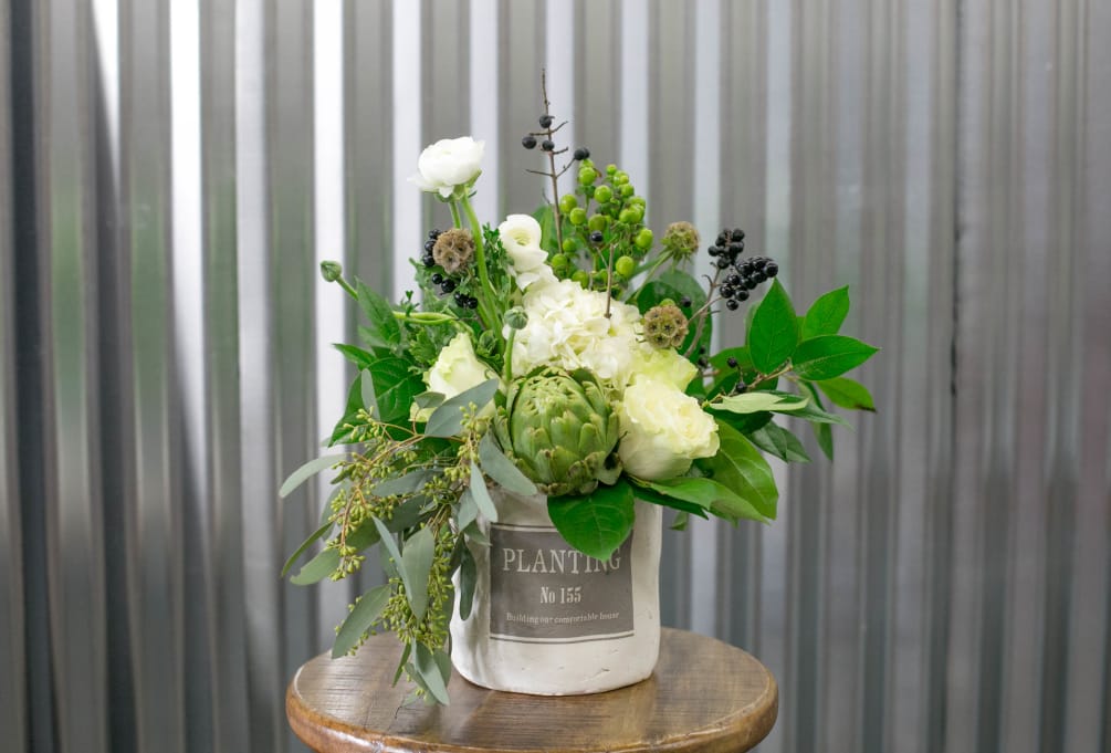 We use some of our favorite greens and flowers such as hydrangea