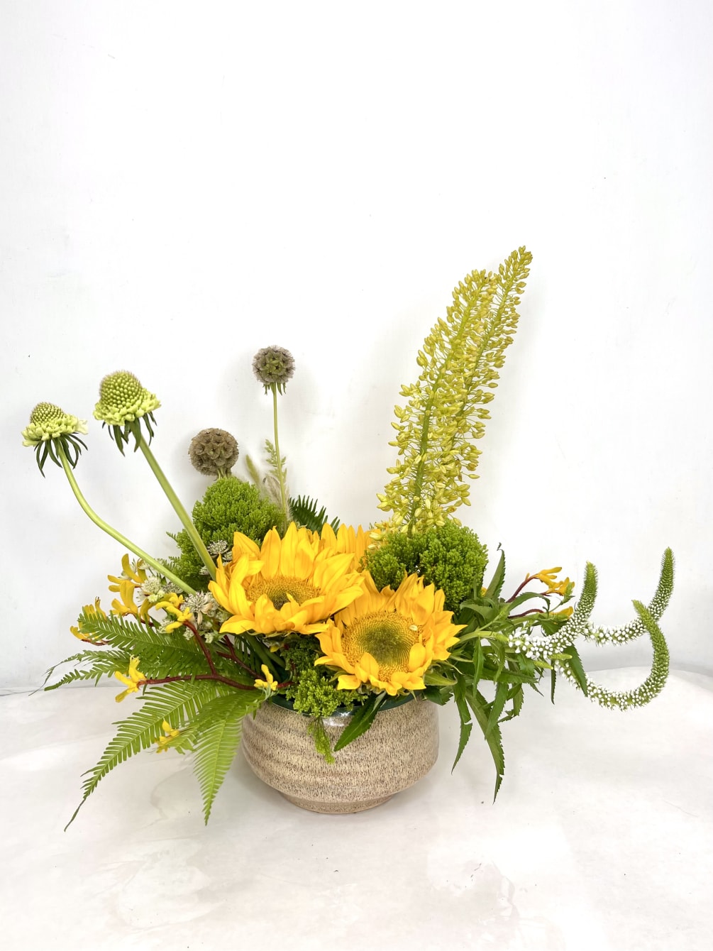 Named after the Goldfinch songbird with its beautiful yellow colors, this arrangement