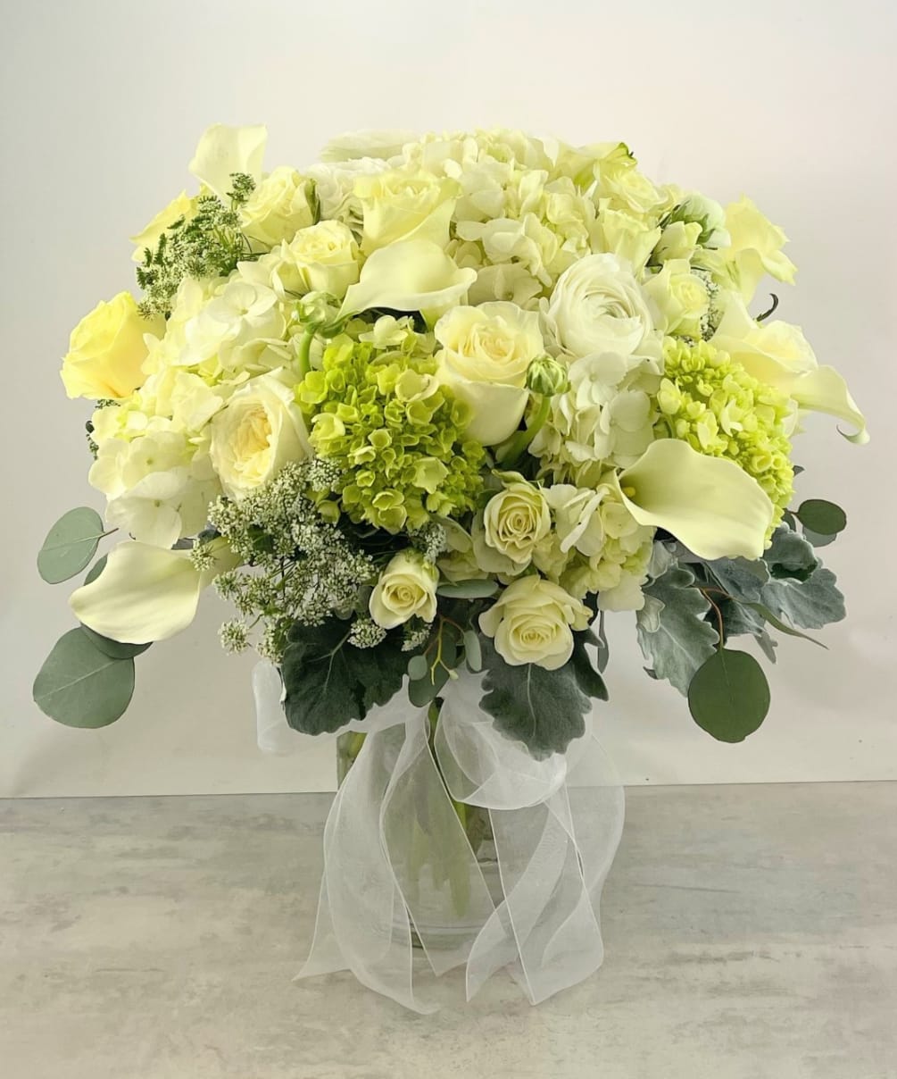 Beauty, grace and elegance are embodied in this artfully designed bouquet. Whether