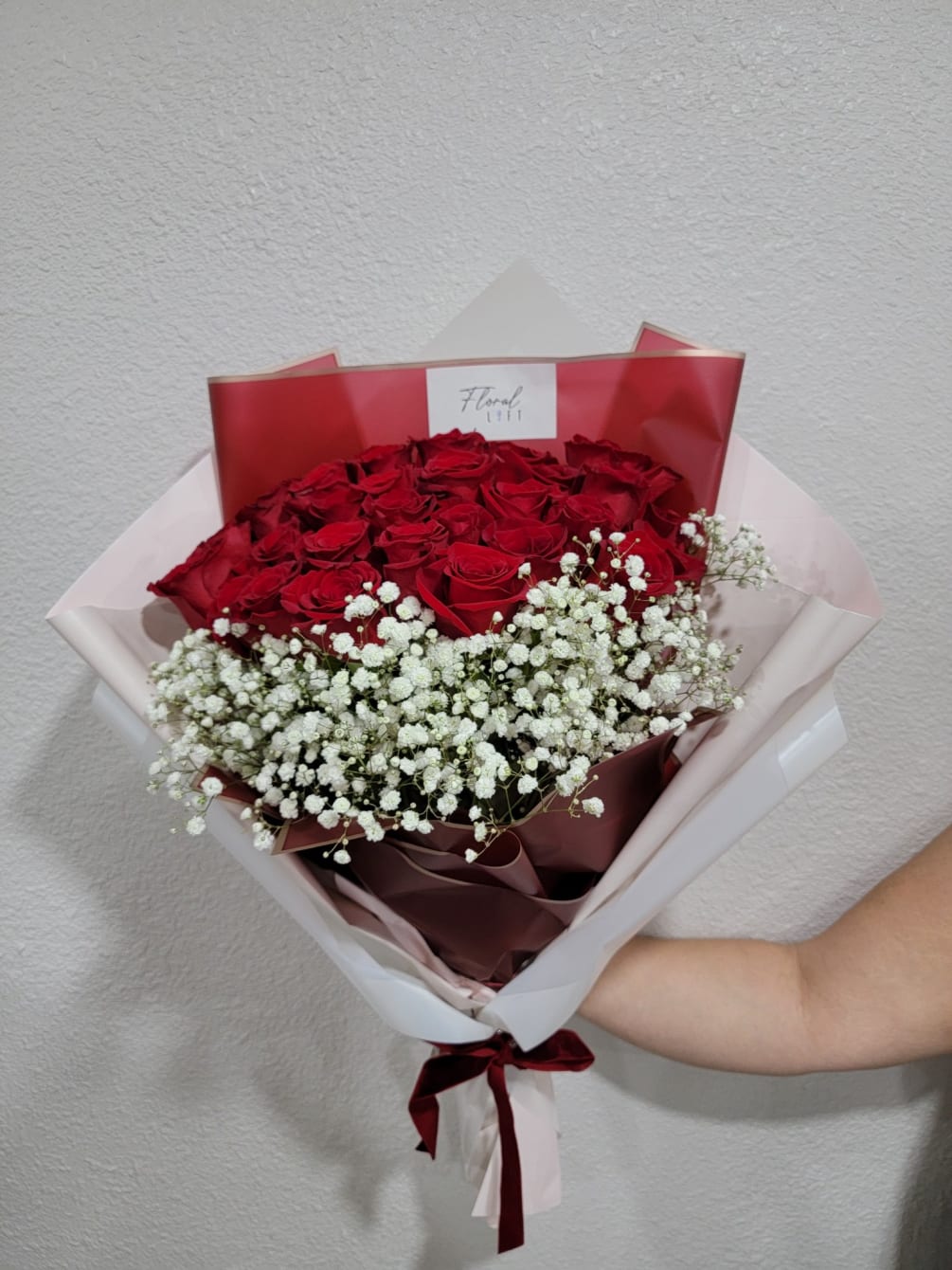 2 dozen red roses and babies breath