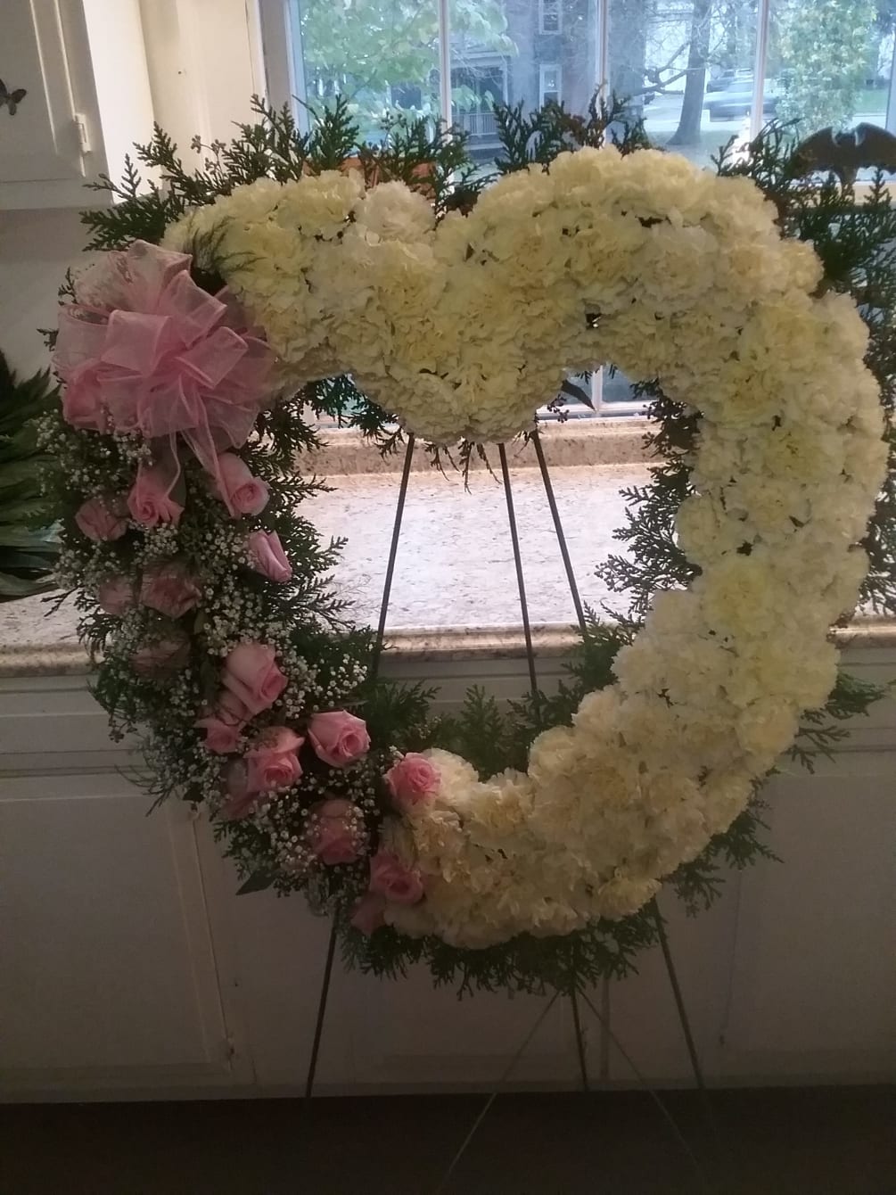 18 pink roses  and white cusion mums make this heart a