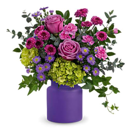 This awe-inspiring mix of roses, asters and hydrangea is sure to take