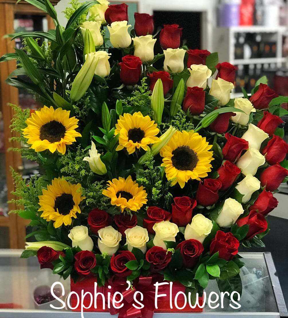 Arrangement Is build of approximately 50 total roses accompanying by by sunflowers