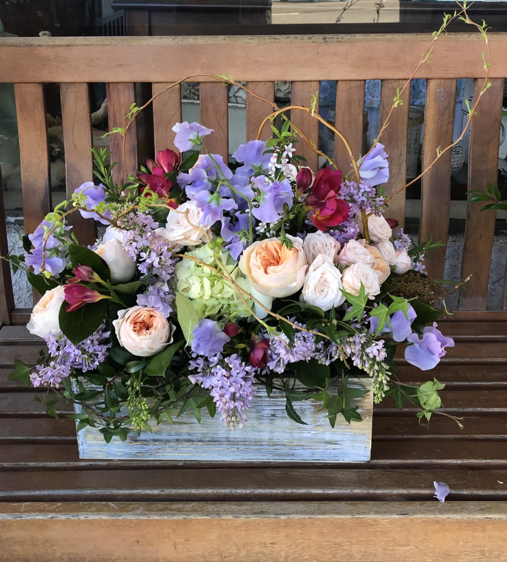 Our most glorious garden style arrangement, featuring garden roses, imported sweet peas