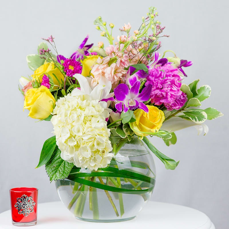 A Deluxe lavish bouquet filled with fresh mix blooms, bringing a classy