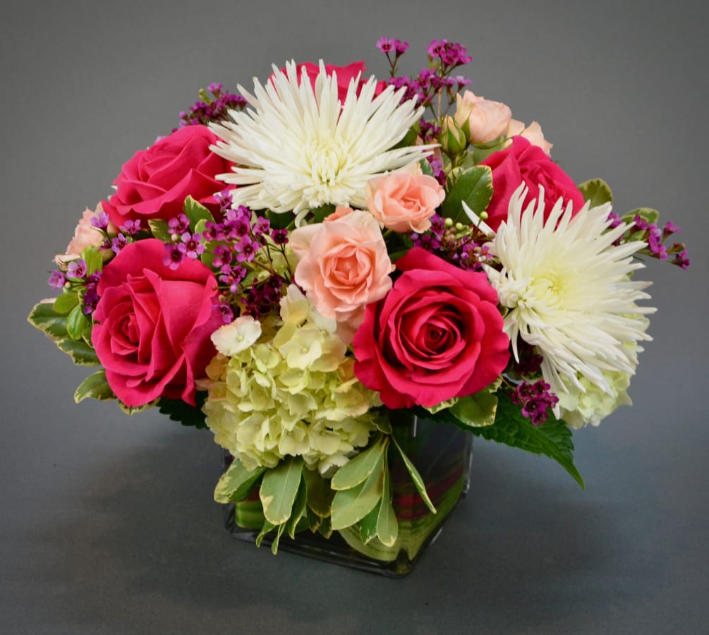 A loving combination of roses with mixed flowers, bright and lovely
