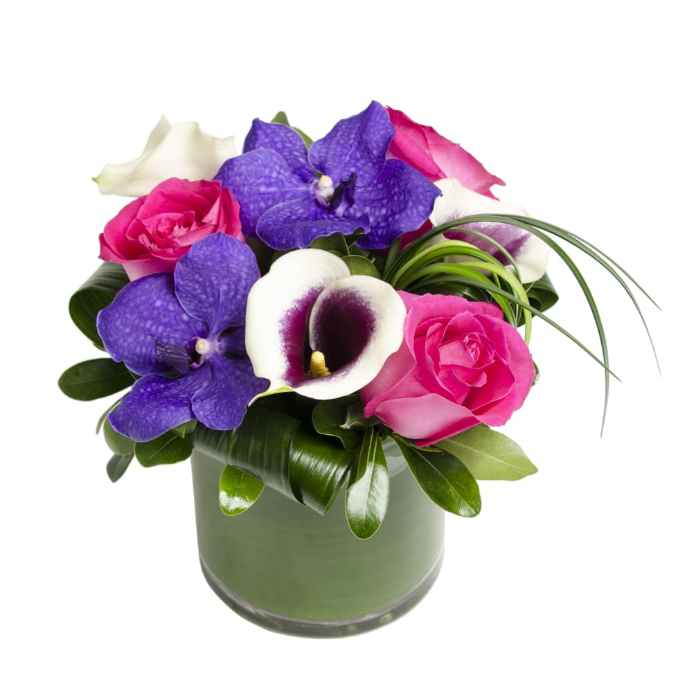 This arrangement of purples and pinks is a perfect gift for the