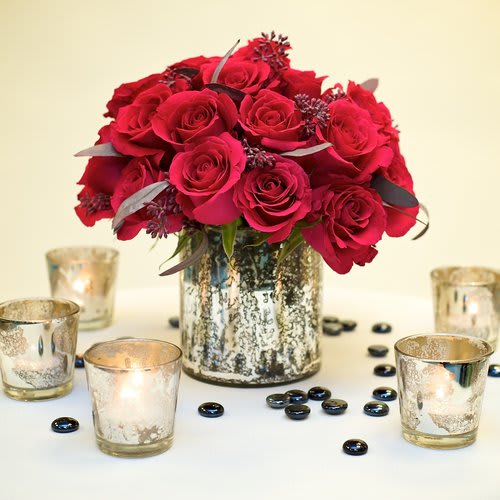 Mass of premium roses with high-end accents such as seeded eucalyptus in