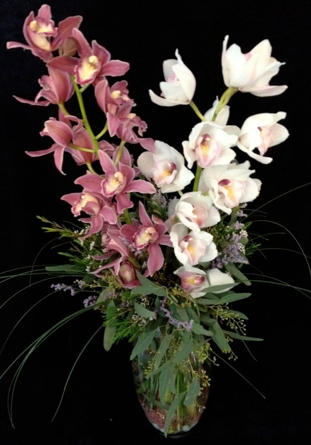 Send this beautiful arrangement with 2 cymbidium orchids to someone special in