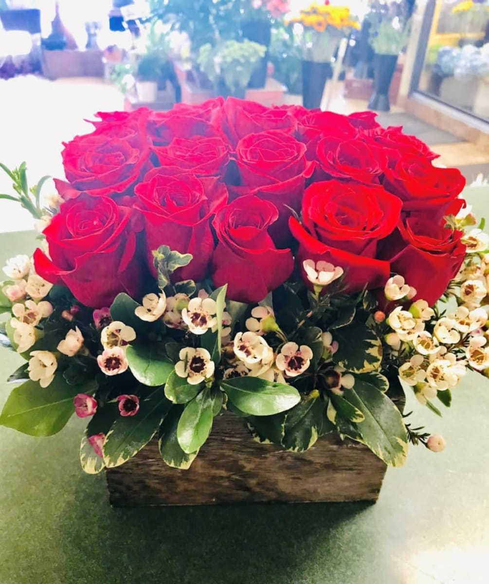 Premium red roses in a beautifully crafted wooden box