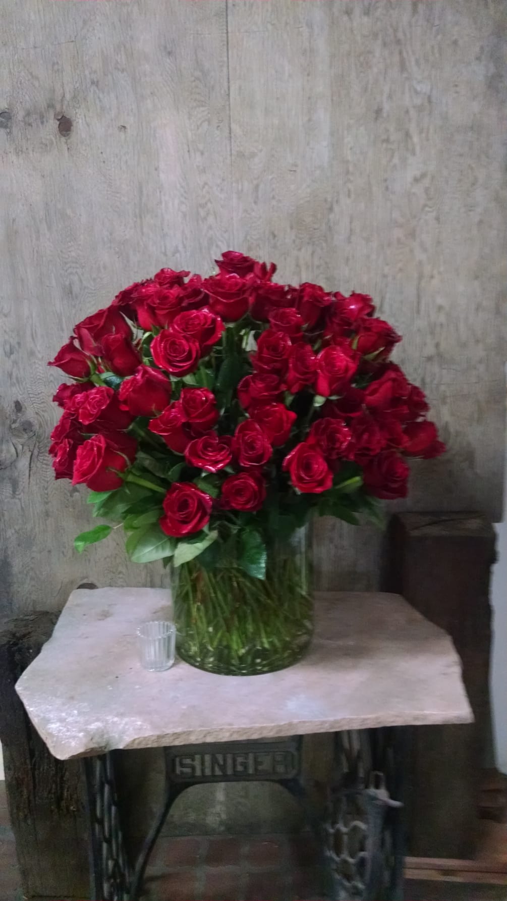  100 red roses in a cylinder vase.  Wow factor.
Quantity Limited