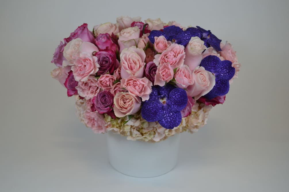 Soft pink Roses, and Lavender Roses also Spray roses and some Vanda