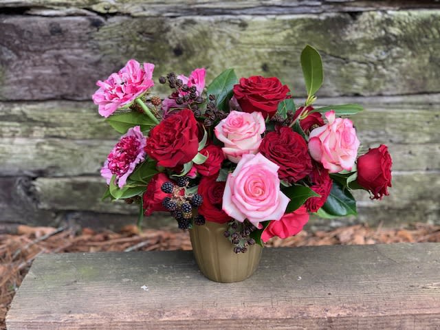 lush mixed arrangement of the finest quality flowers in a classic style