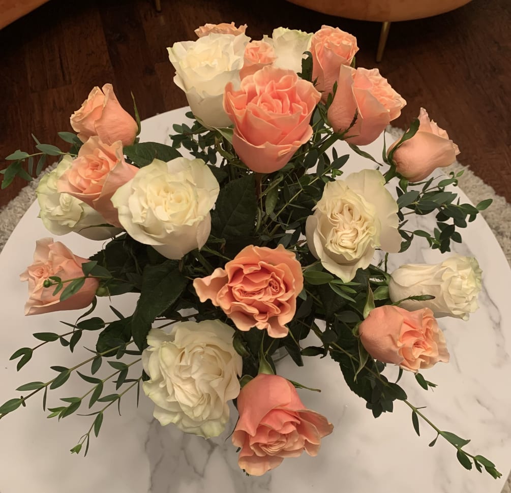 This fragrant arrangement comes with 20 pink and white roses and fresh