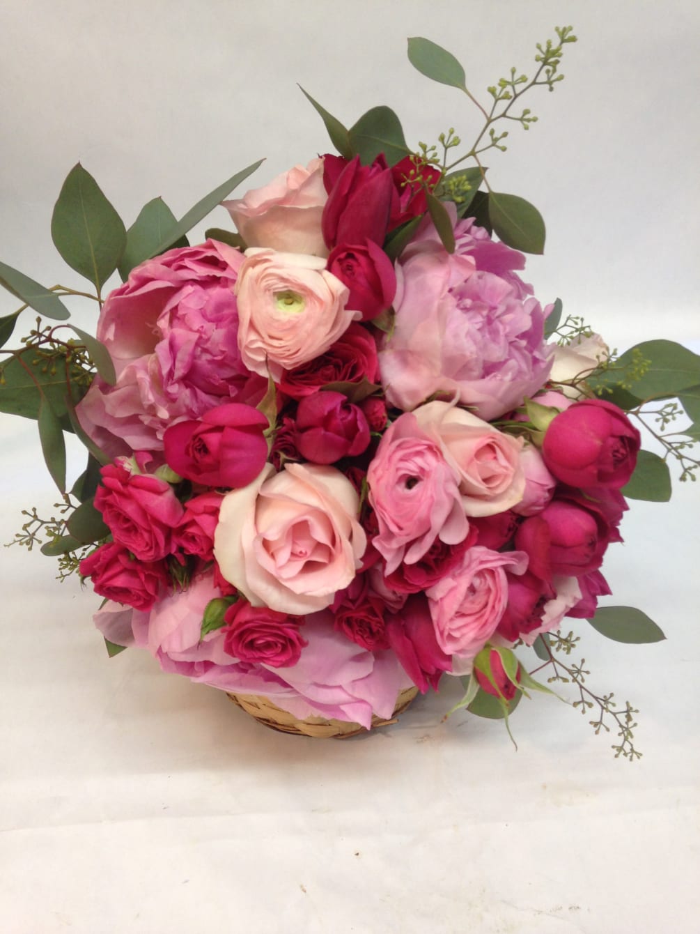 This mix of soft and hot pink flowers looks beautiful with white!